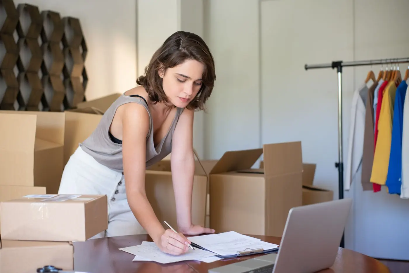 Online shop owner processing orders