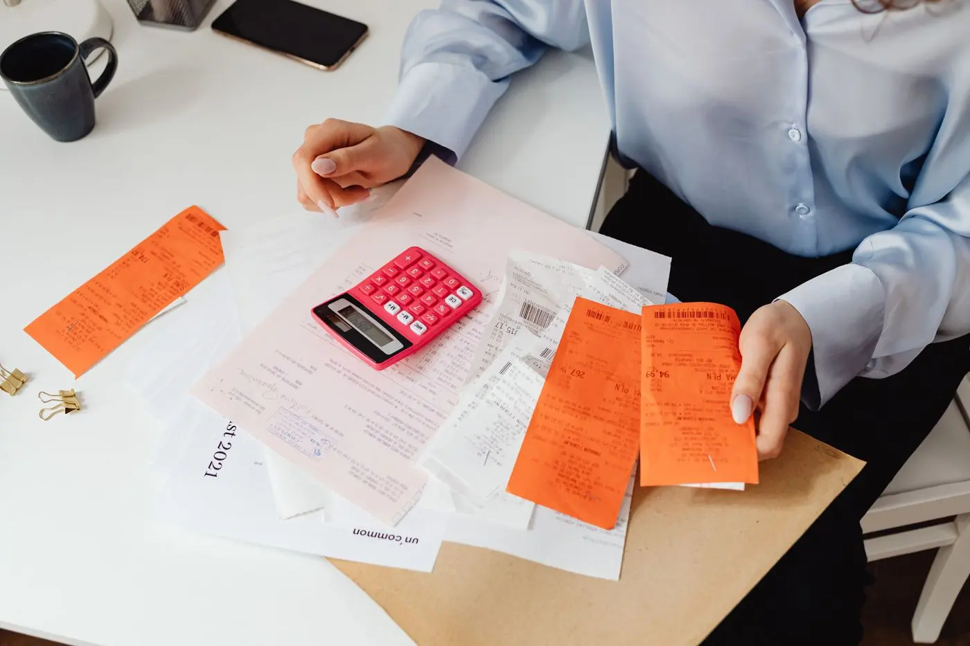 Receipts and a calculator on a table